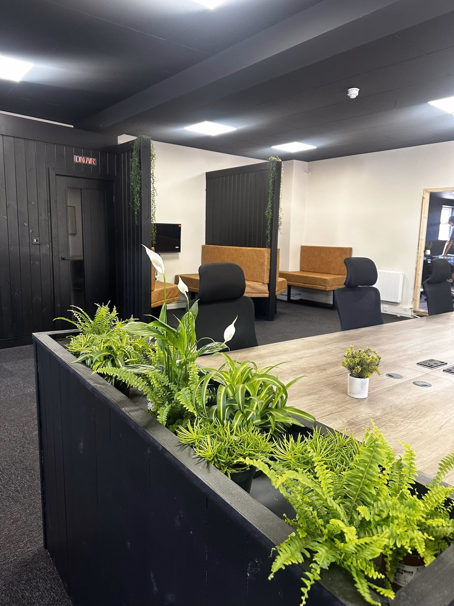 Planted communal tables inside Howfen House